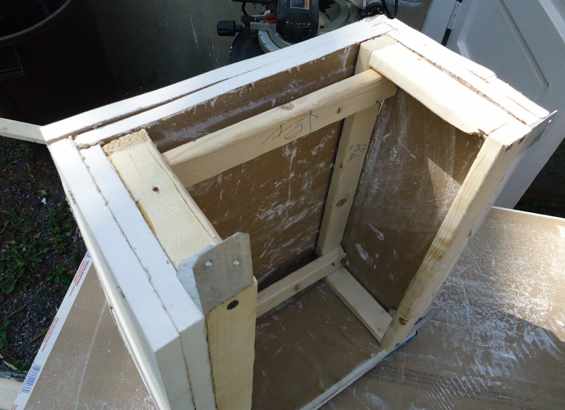 A DIY golf simulator enclosure built into a home space