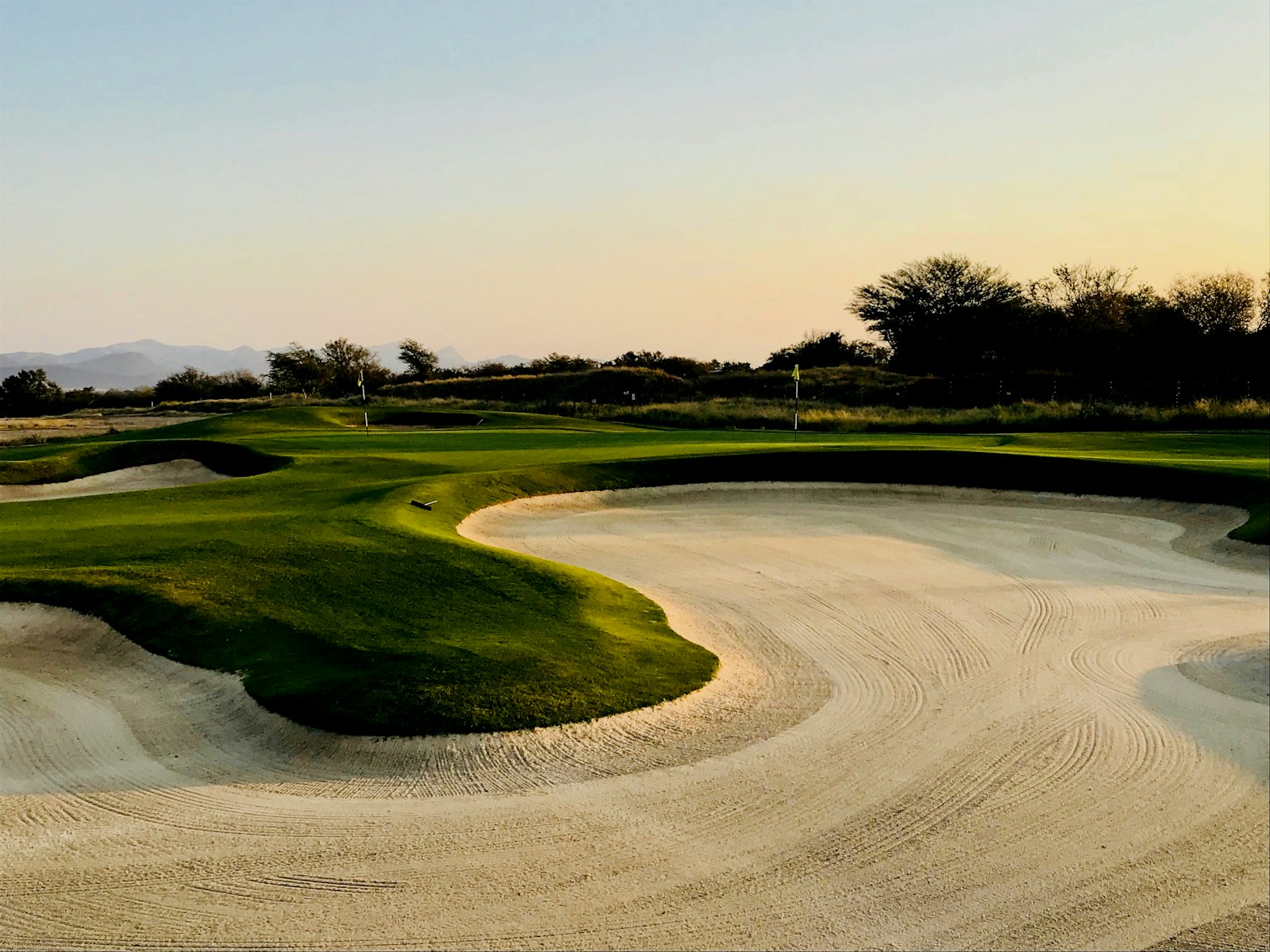 A rendered golf course hole as shown in golf simulator software