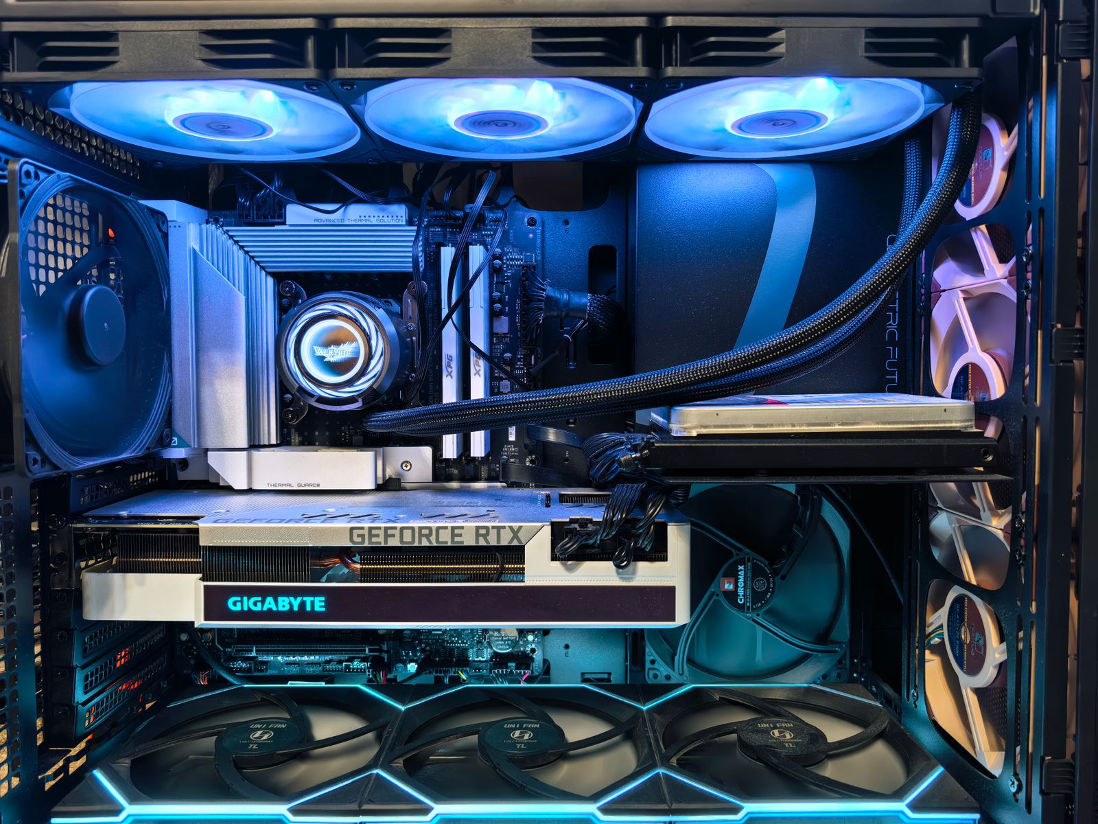 A gaming PC tower with an RTX-class graphics card, the hardware that drives golf simulator visuals