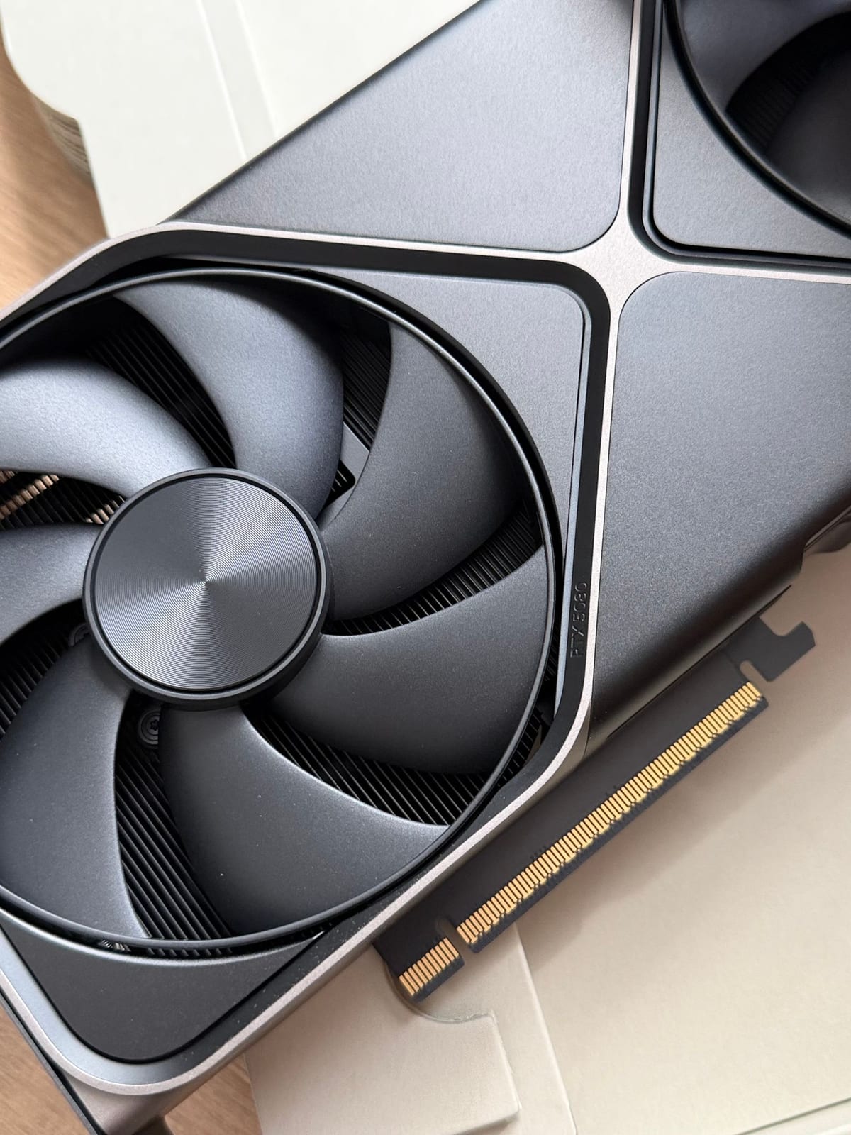 Close-up of a modern graphics card with a large cooling fan
